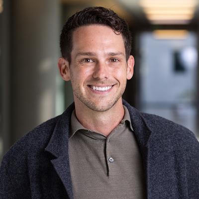 Portrait image of Stephen Speicher standing in hallway